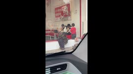 Passing driver buys food for impoverished mother staring into restaurant