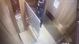 Girl gets stuck in lift while moving a whiteboard