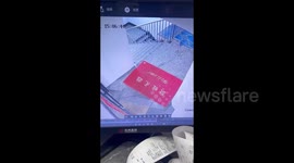 China: A Man Steps on a Slippery Carpet Almost Roll Down Stairs
