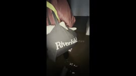 Residents struggle to escape flooded building in Stockport, England, UK