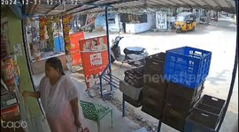 Customer dodges truck hurtling toward her at shop in India