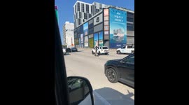Sharing A Scooter On The Highway