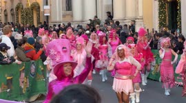 A team of cosplayers in pink parades among spectators during the traditional New Year’s Day Parade in Rome.
