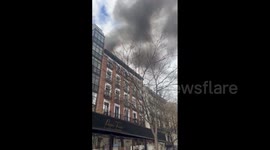 Spain: Smoke Over Madrid After Fire At Building Under Construction