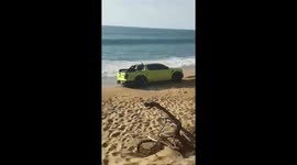 Tourist's rental car gets stuck on beach in Phuket