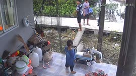 Toddler leans on tractor toy and topples from patio