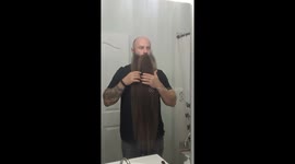 Man who hasn't cut beard in 8 years demonstrates how to braid it