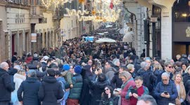 Via Condotti full of people on the day of the beginning of the winter sales in Rome.