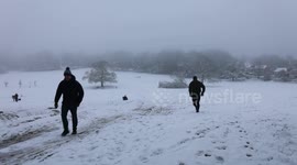 Heavy snow leads to suspended flights and motorway chaos across Britain