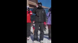 Skiers dressed in traditional Chinese costumes