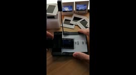 Chinese man demonstrates film photography process