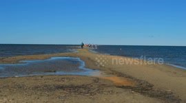 Beautiful windy beach with headland on a sunny day in Finland.