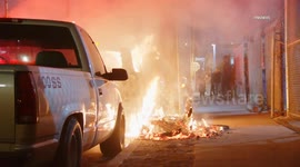 US, Los Angeles: Historic South Central Car Burns And Damages Vehicle Behind It
