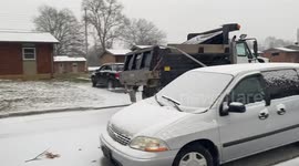 Salt Truck Driving Througu Snowy Neighborhood during Kentucky Snowstorm
