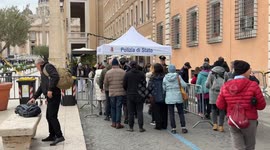 Carabinieri and police officers in Via della Conciliazione carry out preliminary checks on people heading towards St. Peter's Square on Epiphany Day in Rome.