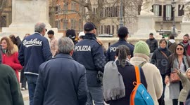 Two police officers guard Ponte Sant’Angelo on Epiphany Day in Rome.