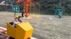 China: A young boys rides a roller coaster