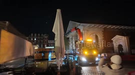 The grand Covent Garden Christmas Tree gets cut down by workman