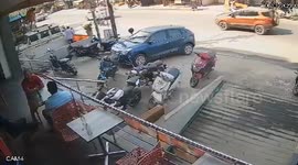 Out-of-control mini tractor crashes into parked car and motorcycles