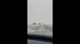 Tractors clear snow from runway at Indianapolis airport