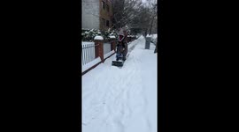 My friend is fun loving and when it came time to clear the sidewalk from the big snow he dressed up in his T-Rex costume