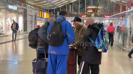 Volunteers distribute food to regulars at Termini Station in Rome.
