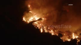 US, Los Angeles: Altadena Wind Driven Brush Fire Breaks Out