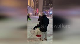 US: Children Sled Down Snow-Covered Streets in Downtown Kansas City