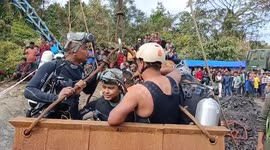 Rescue teams battle to save miners trapped underground as water levels rise in India