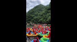 Hundreds of brightly coloured dinghies fill lake for rafting season in China