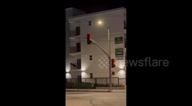 US: Strong Winds Shake Traffic Light In Sylmar As Wildfires Rage Across LA County