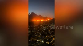 Video shows huge wildfire burning through Los Angeles suburb