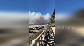 Smoke hangs over Santa Monica beach as Palisades Fire spreads