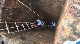 Terrifying moment rescuers wrestle with huge python inside deep well in India