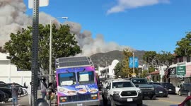 Palisades Fire smoke rises above homes along Piedra Morada Drive