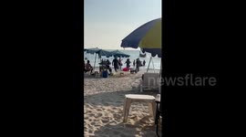Australian tourist crashes jet ski before being attacked with FLAGS by furious beach vendors