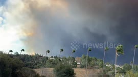 Smoke from the Eaton Fire shrouds homes in Glendale, California