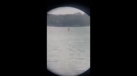 Santa Relaxes On Paddleboard