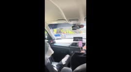 Gravity-defying: A man masters the art of flat-lying motorcycle riding in Malaysia