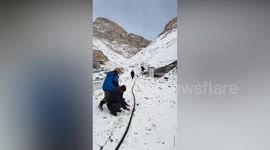 Technicians defrost frozen water pipe with flames in northern India