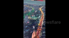 Creative father uses fork to add light effect on painting