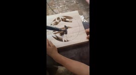 Chinese craftsman uses carving machine to create intricate wooden bamboo design