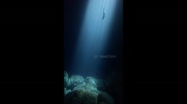Freediving to the Depths: Mesmerizing Freefall in a Sunlit Menorca Cave
