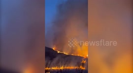 Los Angeles wildfires: Plane drop water on Kenneth Fire