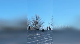 US: Olathe Officer's Snowy Slide Sparks Joy Online