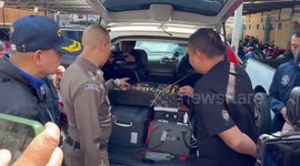 Two Chinese men arrested for 'driving around Bangkok spreading scam messages via SMS in crowded areas'