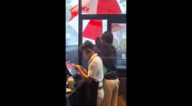 Drive Thru server's umbrella blows away during storm