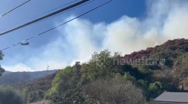 Death toll rises to 16 as firefighters continue to battle spreading wildfires in Los Angeles
