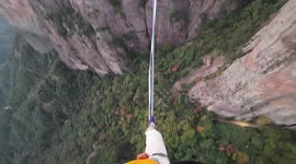 High-wire acrobat conquers skyline over valley in China