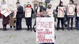 Israel-Hamas War: A protester holds up a sign reading ‘Free Dr. Hussam Abu Safiya’ while behind him other protesters form the slogan ‘stop genocide’ with signs during the demonstration of solidarity with Dr. Hussam Abu Safiya of the health doctors for Gaz